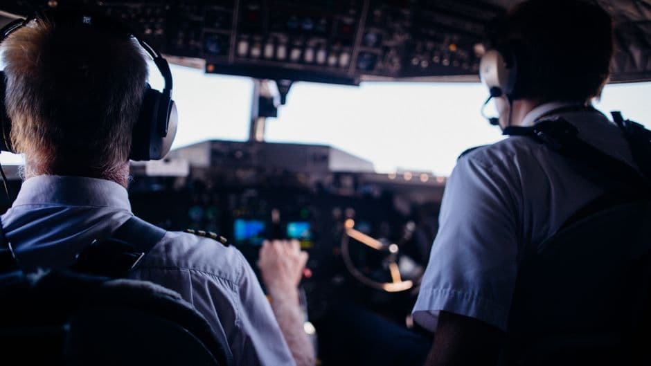 Flight deck instrument panel and throttle quadrant of an airliner in cruise
