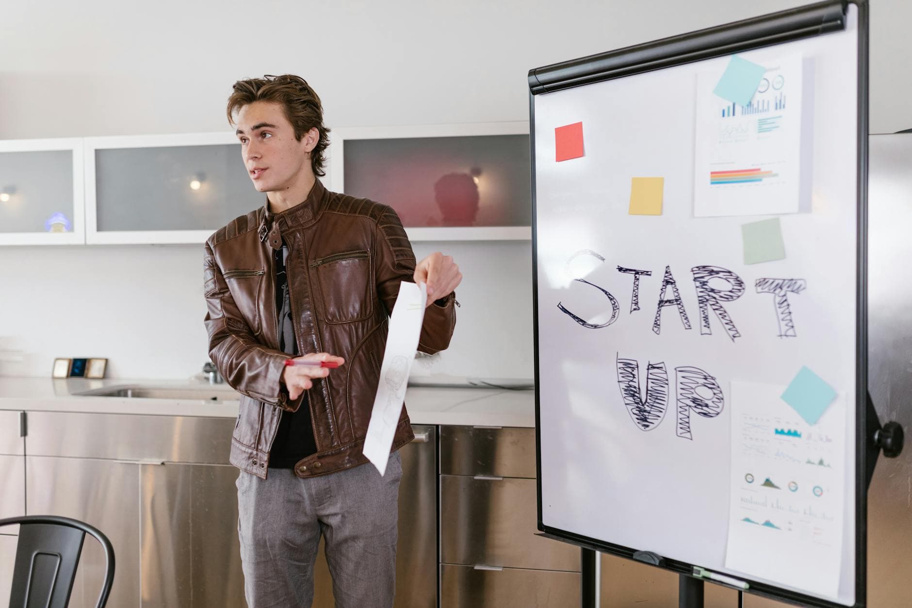 Startup founder meeting with accountant in modern co-working office space in London