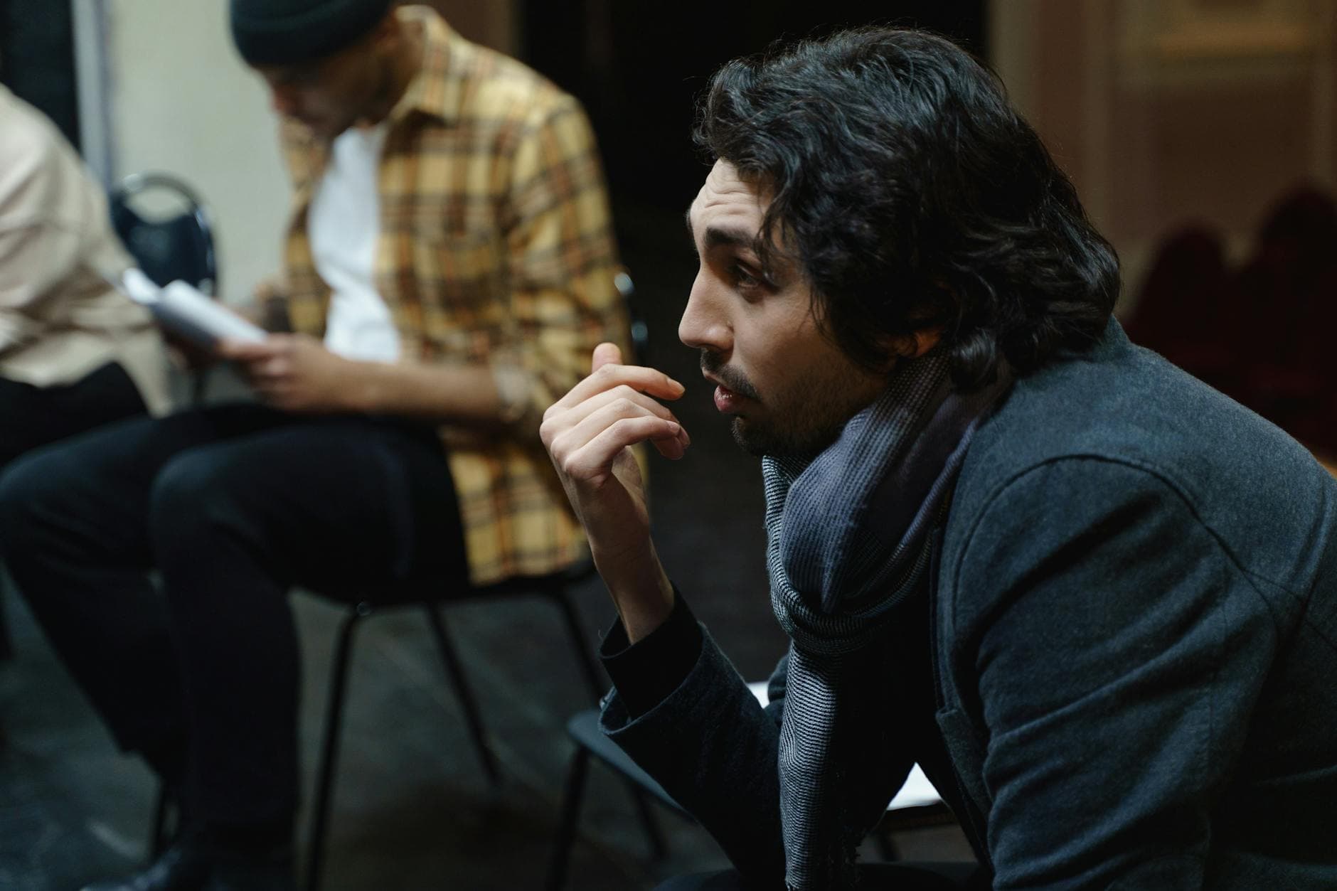 Actor reviewing financial paperwork with an accountant in a London office near Soho