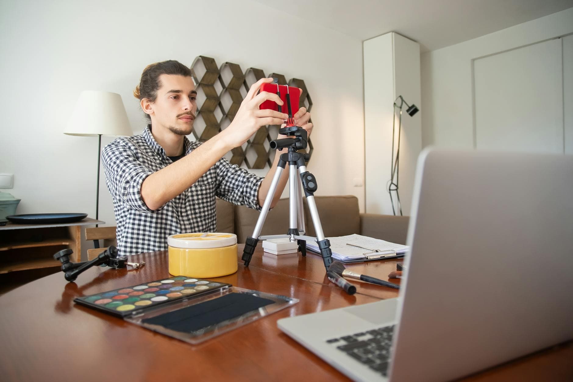 UK accountant reviewing tax documents for a content creator client in a modern office