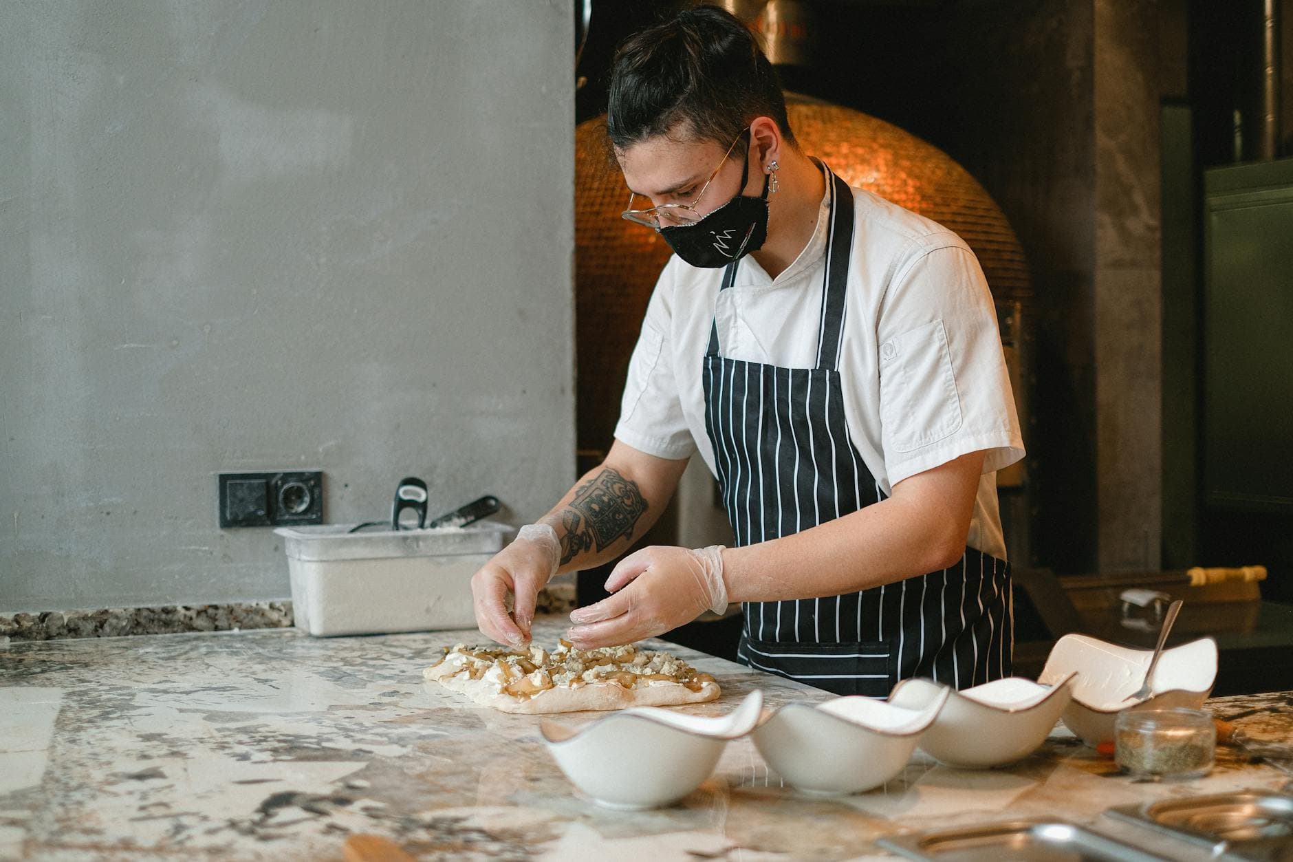 Chef and accountant reviewing restaurant financial reports in a modern cafe in Manchester Northern Quarter