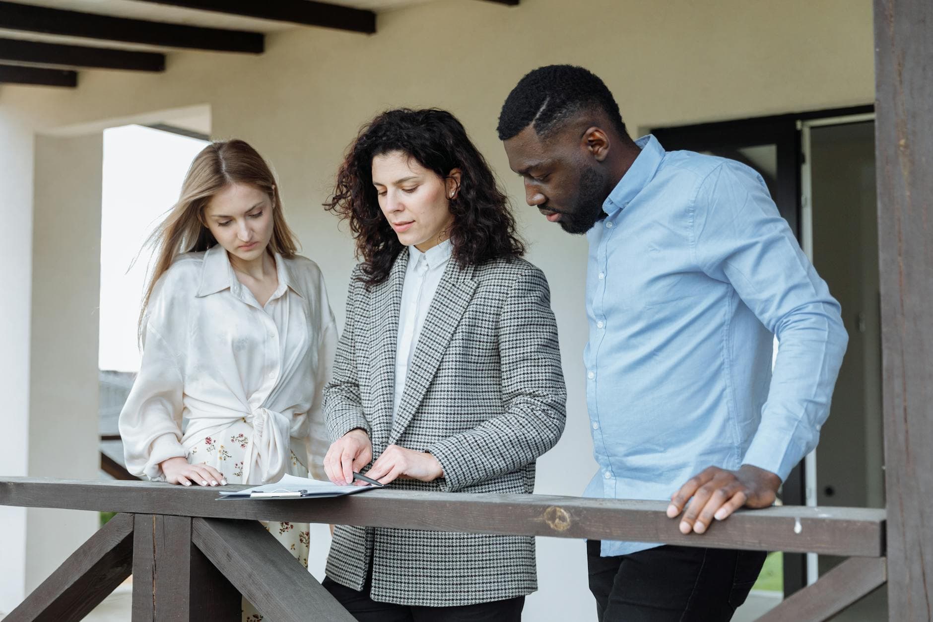 UK property owner reviewing capital gains tax paperwork with accountant in Manchester office