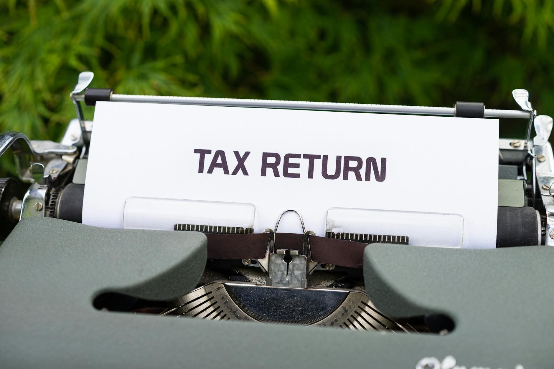Accountant reviewing a corporation tax refund letter for a closed company with HMRC correspondence on a desk.
