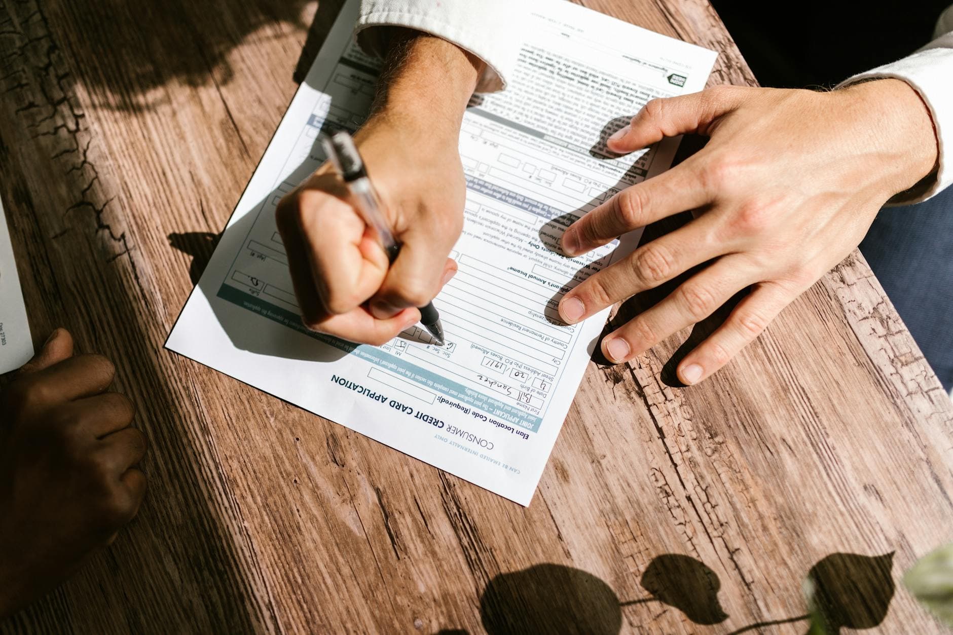 Director reviewing a director's loan account statement with a calculator and company accounts on a desk in a UK office