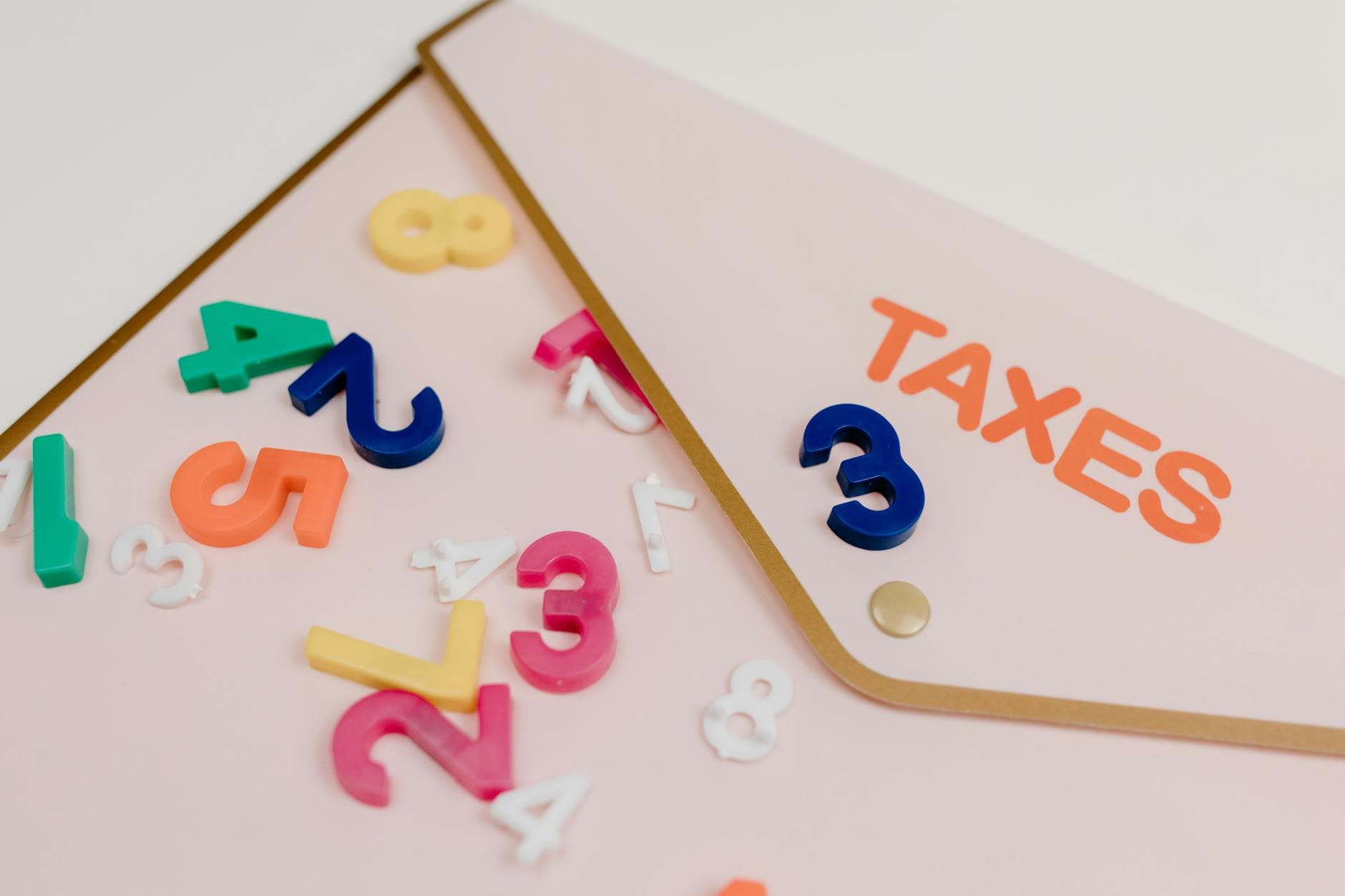 UK accountant reviewing earn out payment tax treatment documents for a company sale
