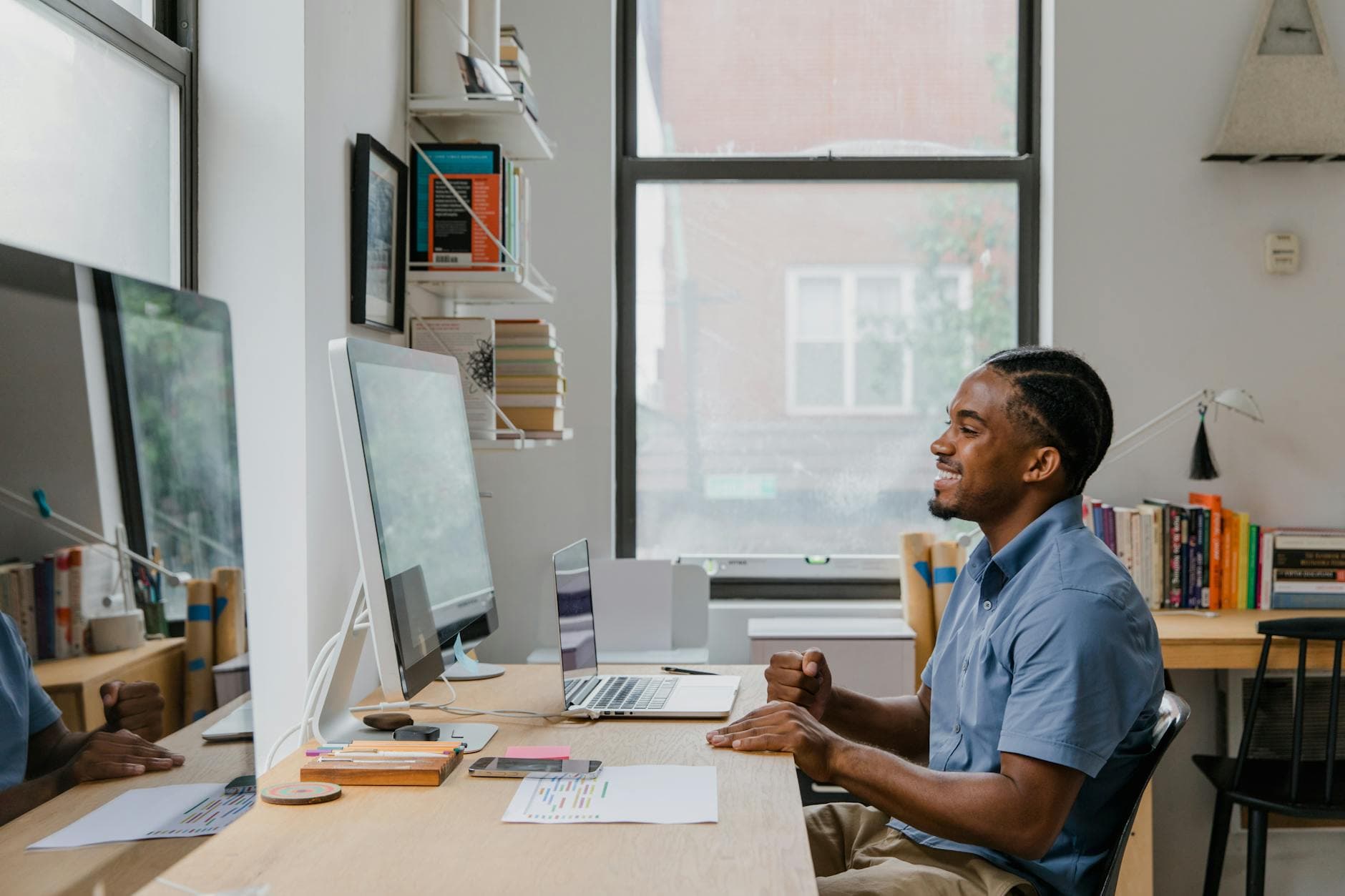 UK accountant reviewing home office expense calculations on a laptop at a desk in a modern home office in Manchester