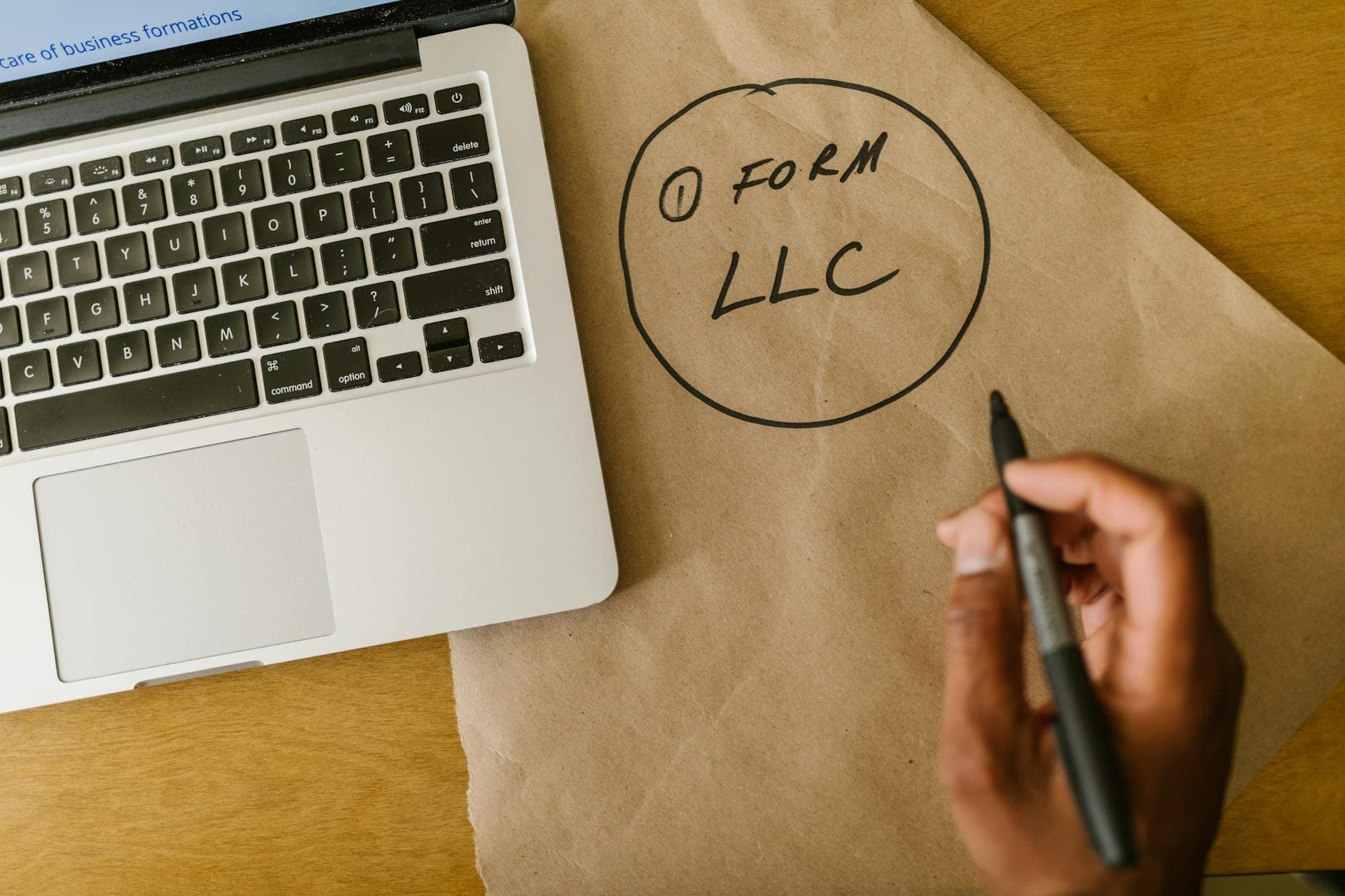 Professional accountant reviewing Companies House name availability check on a laptop in a modern UK office