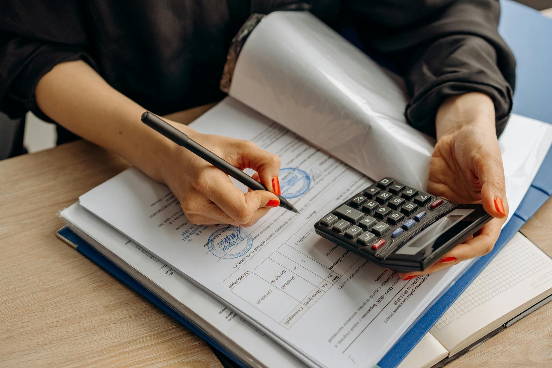 VAT accountant reviewing HMRC compliance check correspondence in a Manchester office