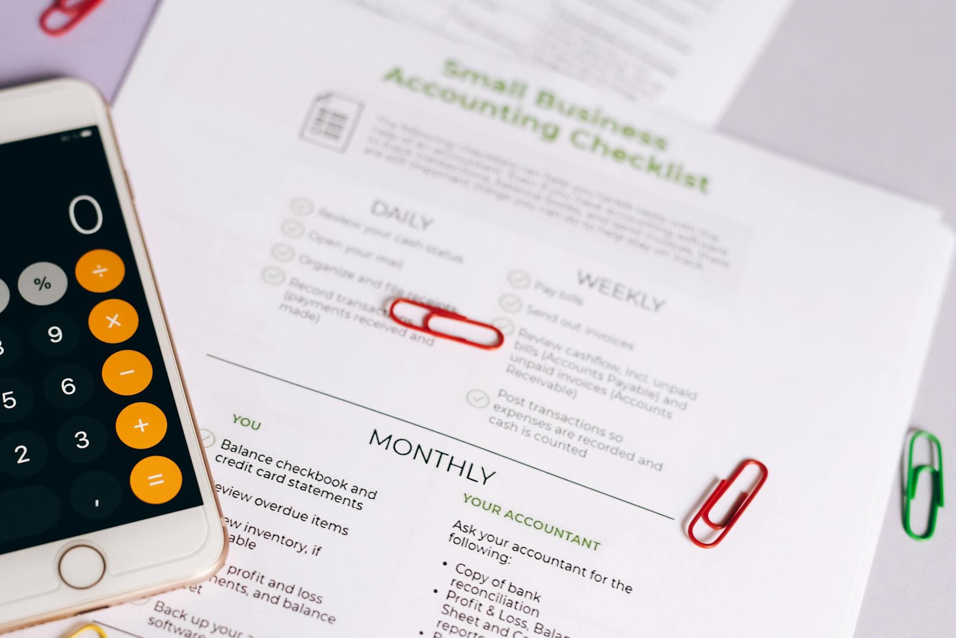Professional accountant reviewing payroll documents in a modern UK office