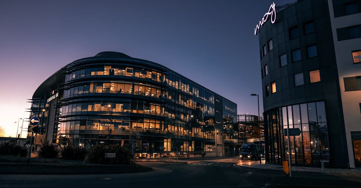 A sleek, modern office building illuminated at night in Southampton city center.