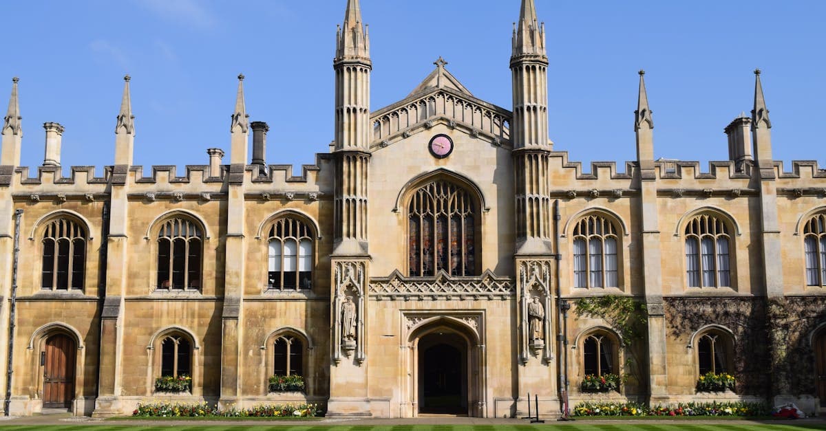 Stunning Gothic architecture of a historic Cambridge college on a sunny day.