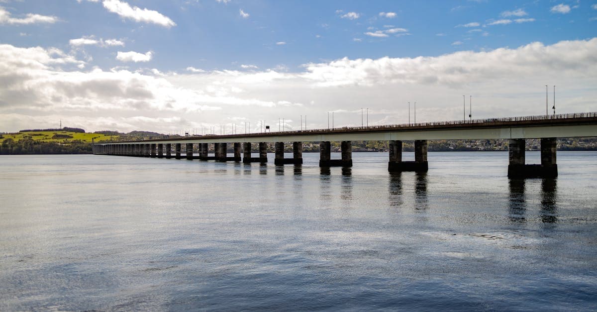 Scenic view of Tay Road Bridge spanning the River Tay in Dundee, Scotland on a sunny day.