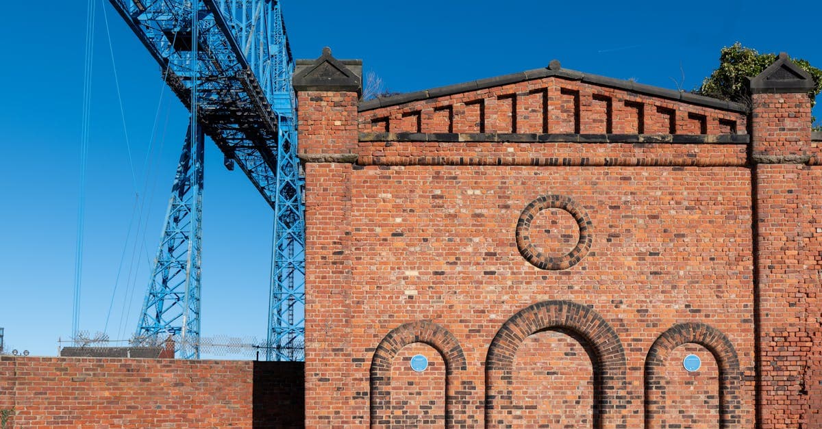 Historic Transporter Bridge and brick building in Middlesbrough, England, showcasing industrial heritage.