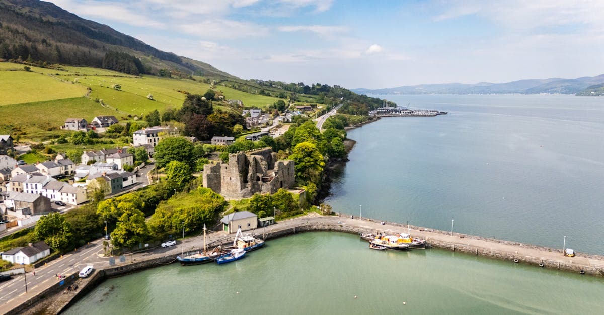 Stunning aerial view of Carlingford Castle and the surrounding harbor in Ireland on a clear day.