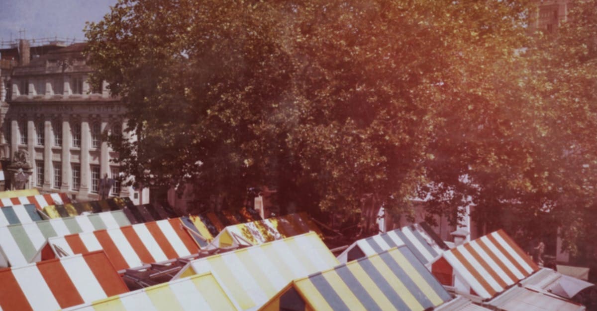 Colorful canopy-covered market stalls in Norwich city center.