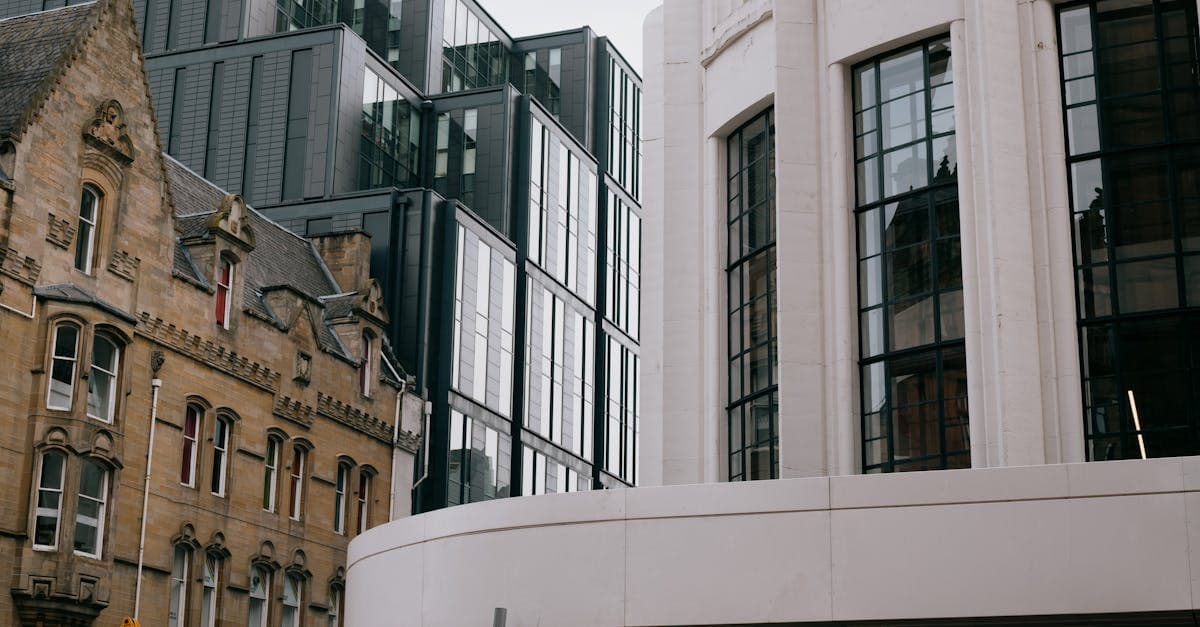 A blend of modern and Victorian architecture in Glasgow, Scotland, showcasing urban contrast.