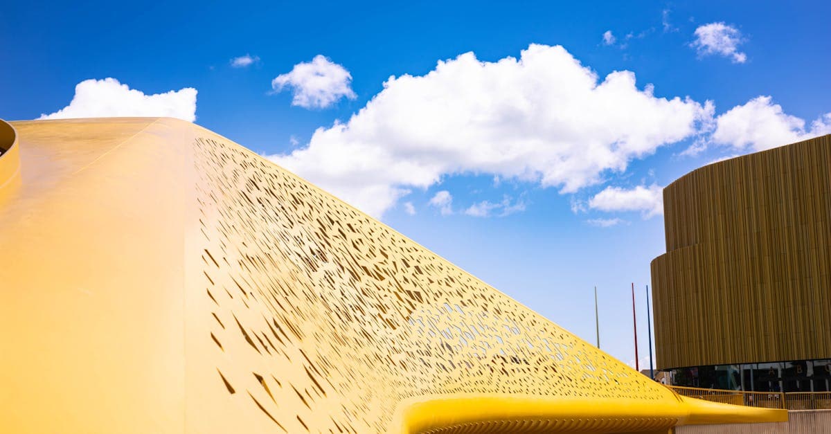 Architectural detail of a modern structure in Swansea, Wales, against a bright blue sky.