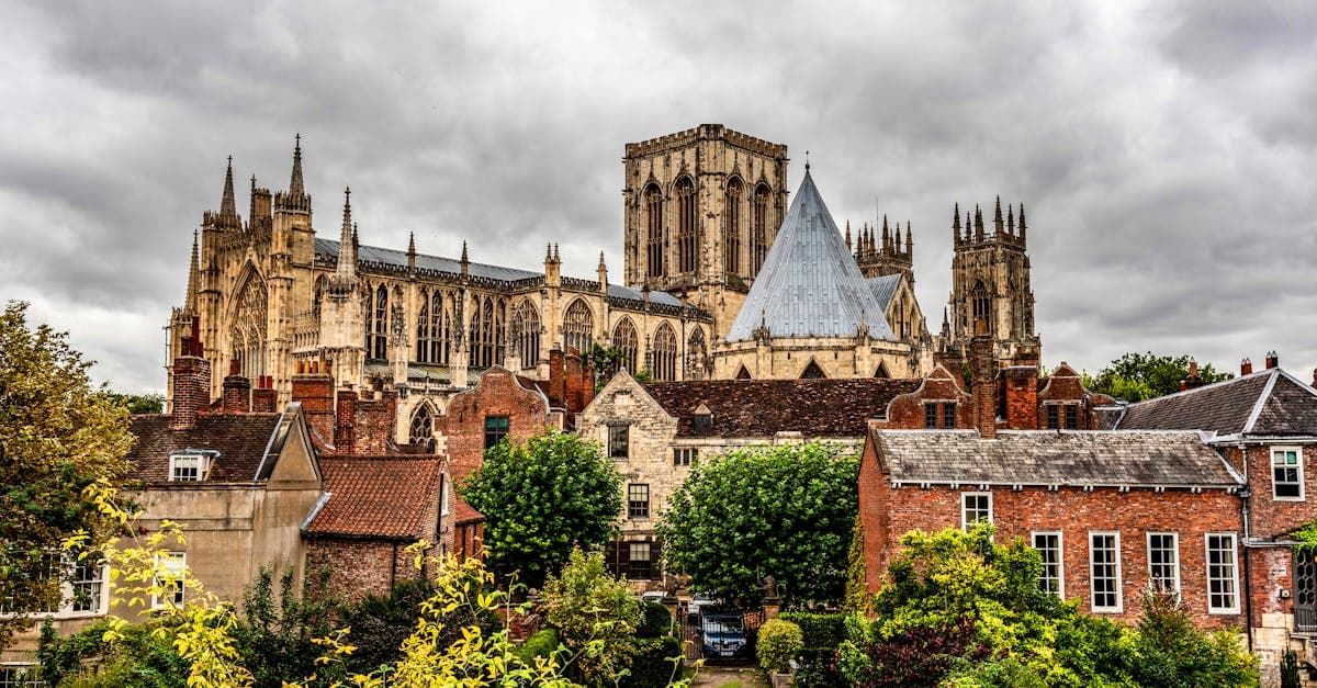 York Minster stands prominently against a cloudy sky in England, showcasing Gothic architecture.