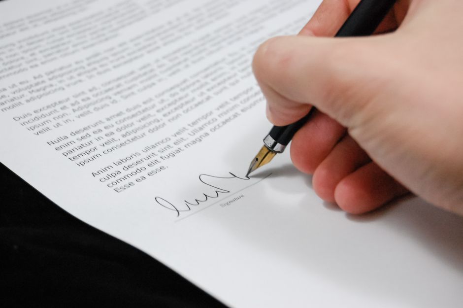 Business owner reviewing capital gains tax figures on an employee ownership trust sale